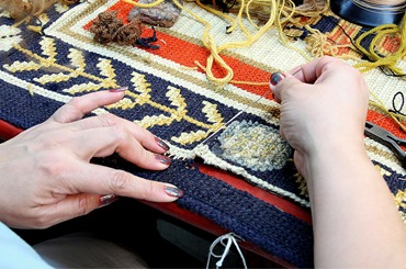 Worker doing Rug Repairing