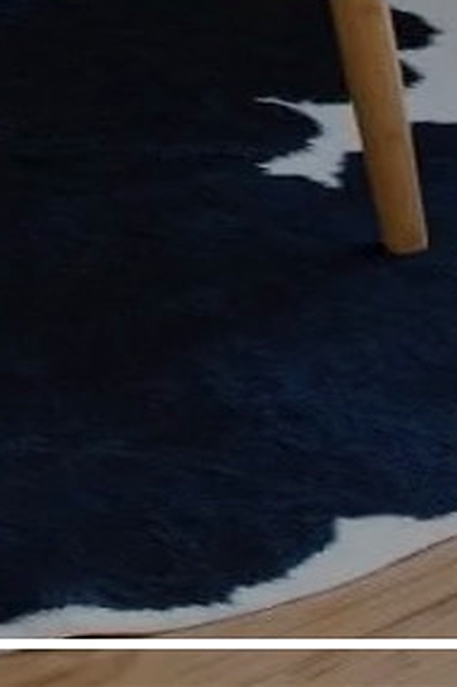Hand-cleaned black-and-white cowhide rug — by ABC Decorative Rugs