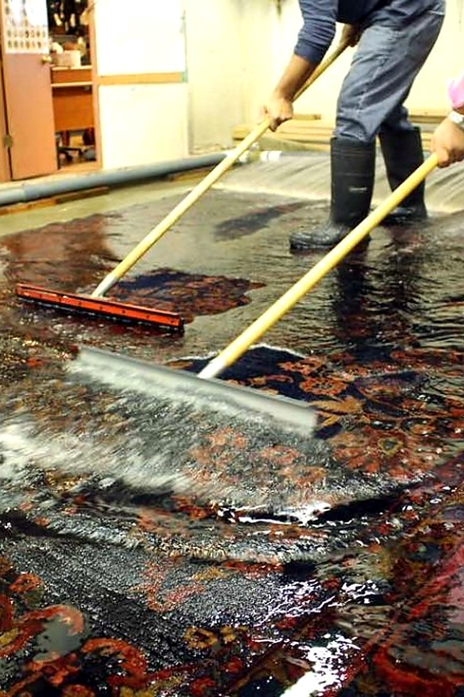 Hand-knotted Oriental rug being hand-washed by ABC Decorative Rugs